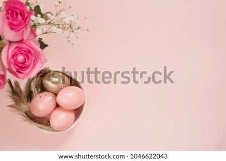 Pink and Gold Easter Eggs. Pastel Easter Concept with Eggs, Flowers and Feathers. Punchy Pastels