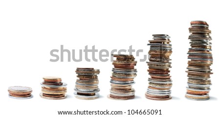 Columns of various coins from the smallest to the largest on a white background.