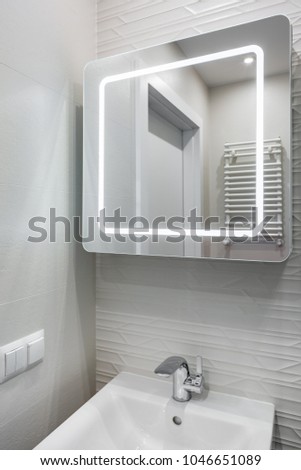 White bathroom with basin and modern, 3d led mirror