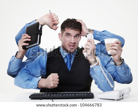 individual businessperson trying to perform and handle more than one task at the same time, not doing very from the looks of things Royalty-Free Stock Photo #104666783