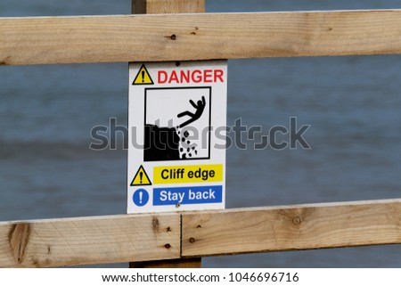 Danger of falling sign. Cliff edge.