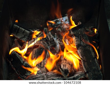 Stock Photo: closeup of live coals in the hot stove