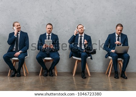 collage of cloned businessman sitting on chairs and using gadgets Royalty-Free Stock Photo #1046723380