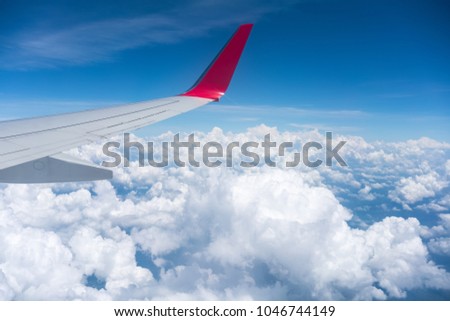 airplane wing view , travel by plane Royalty-Free Stock Photo #1046744149