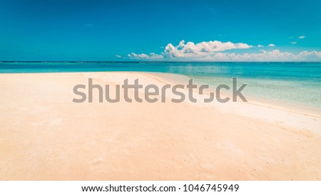 Beautiful sand on beach and blue summer sky
