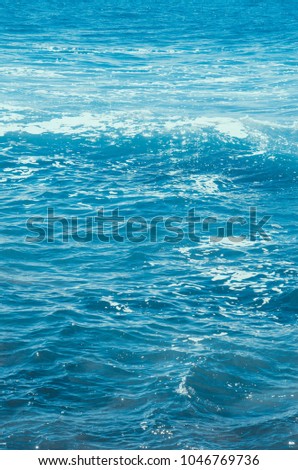 blue water of ocean with splash