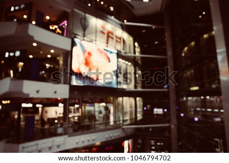 The blurred photo of the layer of shopping mall at night. The abstract concept of prosperous, rich, commercial and business.