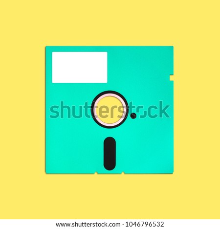 Obsolete floppy disk 5.25 inch, isolated and presented in punchy pastel colors with a blank white customizable label. Nostalgic theme of early computer storage media for factual work, creative design