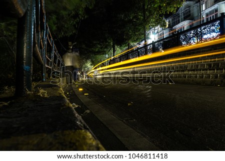 Night photography in Nainital, Uttarakhand, India - Light in the mountains of Uttarakhand. Landscape view of Naini Lake around the mall road of Nainital in mountains. Honeymoon place in India. - Image