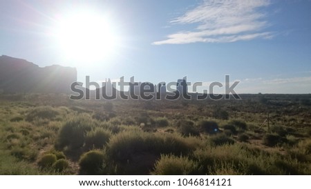 Bright sunshine over the iconic Monument Valley Navajo Tribal Park, Arizona.