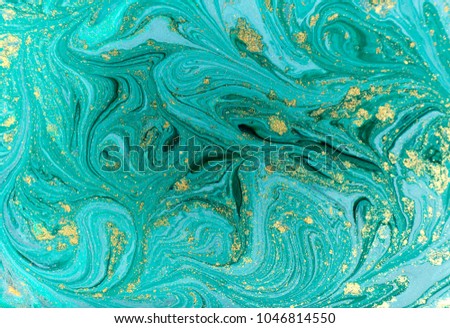 Marble abstract acrylic background. Nature blue marbling artwork texture. Golden glitter. Royalty-Free Stock Photo #1046814550