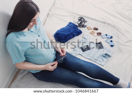 pregnant happy women on floor