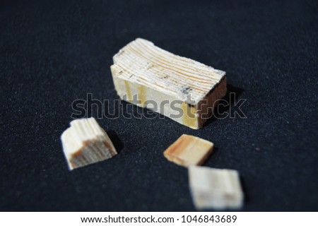  sawdust on a black background.pieces of wood, bars.macro wood for background