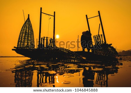 Fishermen fishing in the early morning golden light,fisherman fishing in the river,Thailand,Vietnam,myanmar,Laos