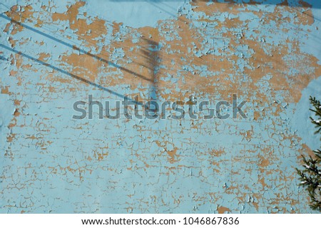 Multicolored peeling blue wall texture and background. Surface with scratches. empty template