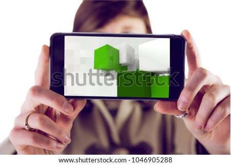 Digital composite of model showing phone with 3D cubes