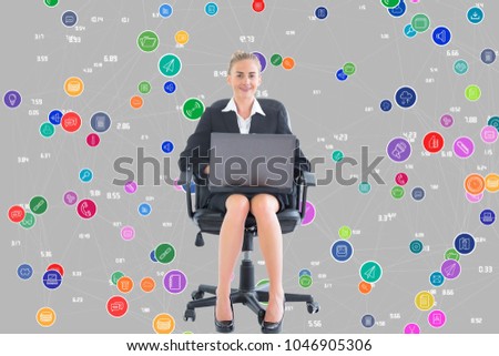 Digital composite of business woman with laptop against background with icons