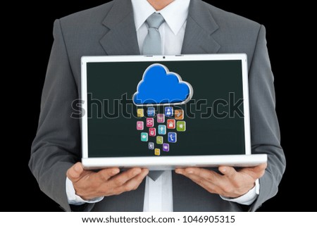 Digital composite of business man with laptop