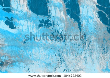 Winter Blue wet abstract paint leaks and splashes texture on white watercolor paper background. Natural organic shapes and design.