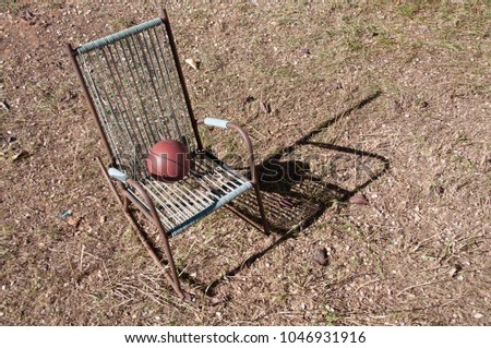 Old children's chair with ball