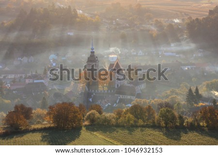 Saschiz fortified church in sunrise. Transylvania, Romania
