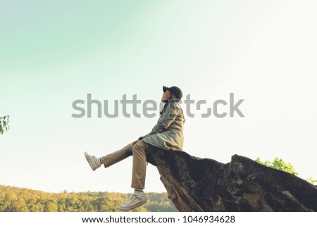 Beautiful girl traveler in nature with camera travel photo of photographer. Lifestyle portrait of pretty young woman having fun in the beautiful nature. Wilderness Travel lifestyle concept.