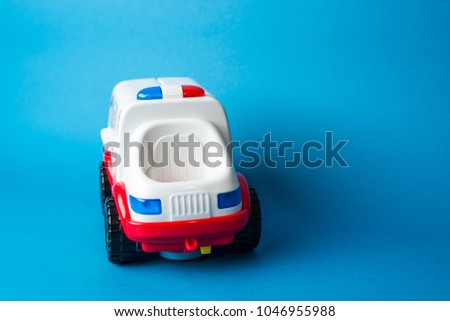 toy ambulance on blue background