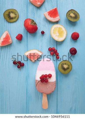 ice cream fruits on a blue wooden background