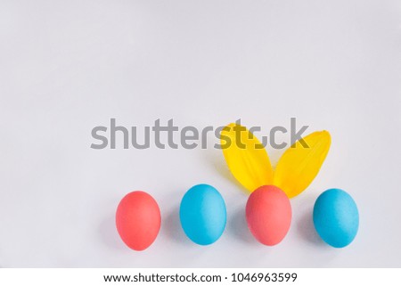 Big Colorful Eggs with Furry Bunny Ears isolated on white background