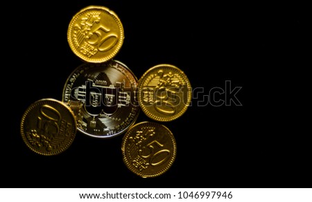 Crypto currency Gold Bitcoin with chocolate euro, BTC, macro shot of Bitcoin coins on black background, bitcoin mining concept