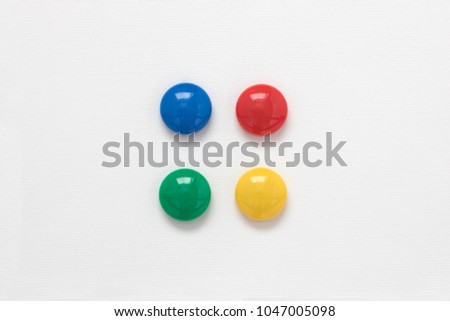 Set of colored round magnetic clip for paper on a white background.