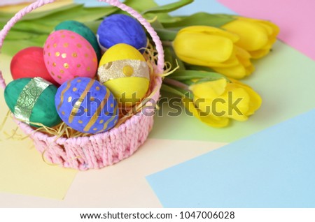 Easter eggs lying in a basket. Inscription Happy Easter. Space for text. Selected focus.
