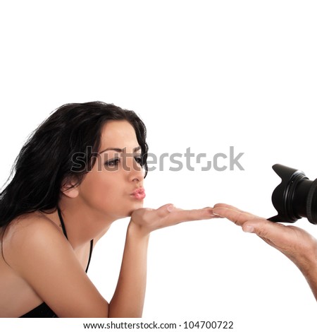 Photographer Taking Pictures of a Model in the Studio