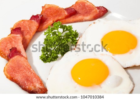 Eggs and bacon making a smiley face
