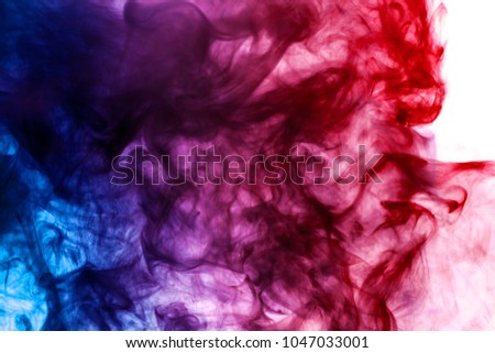 Dense multicolored smoke of blue and red colors on a white isolated background. Background of smoke vape