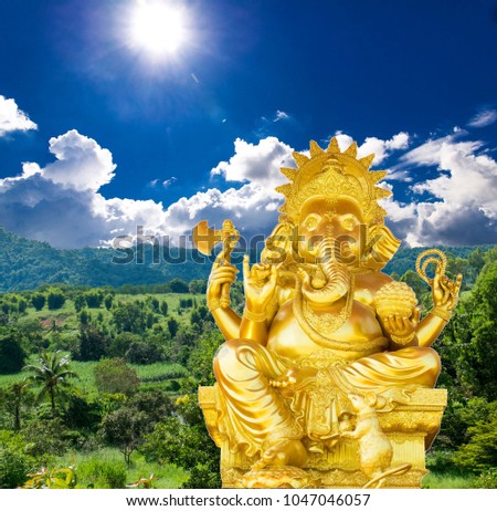 Ganesh Gold on a natural background rub him the sky, the sun, the greatness of religion.