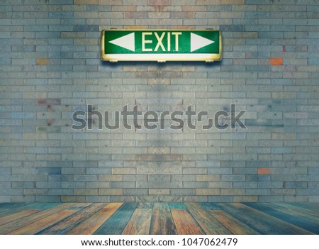 Green exit sign on brick wall , Vintage Style