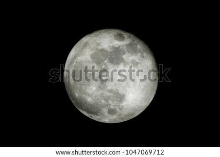 Close up of full moon on the dark night seen with the telescope from northern hemisphere. Showing detail of moon surface. A Night Panorama Lunar Astrophotography isolated background concept. 