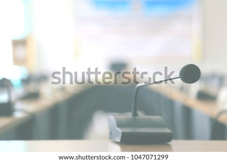 Conference room with microphone on the table selective focus and shallow depth of field