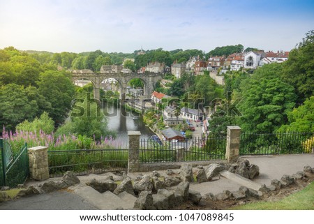 Elevated view of beautiful English town Knaresborough with viaduct, cottages and stone footpath. England, United Kingdom