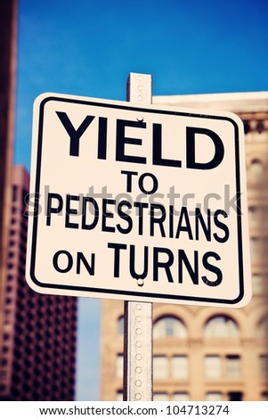 Yield on pedestrians on turns sing in the center of Boston, Massachusetts