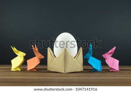 Easter eggs and colorful Easter bunnies, origami, accessories for cards and congratulations with Easter.