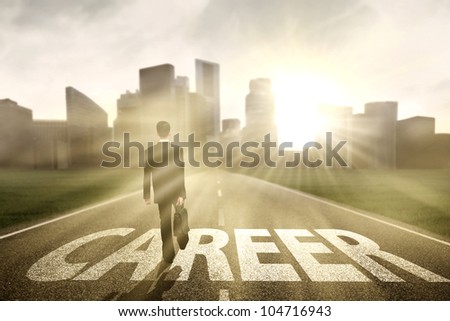 Businessman walking on the right way for a better career Royalty-Free Stock Photo #104716943