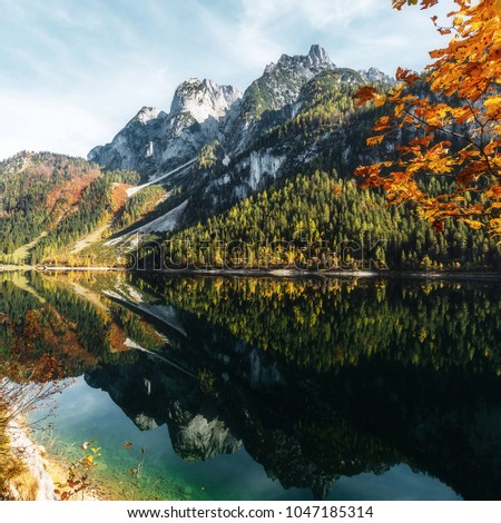 Sunny morning, at Gosausee lake. Picturesque autumn scenery. Lake under Warm sun. view of European Alps, Bavarya, Europe. Beauty in the world. concept of travel. Instagram Effect. Awesome nature place