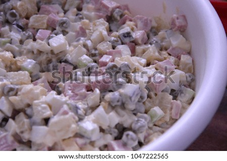 Pictured in the photo delicious salad with mayonnaise and sausage.