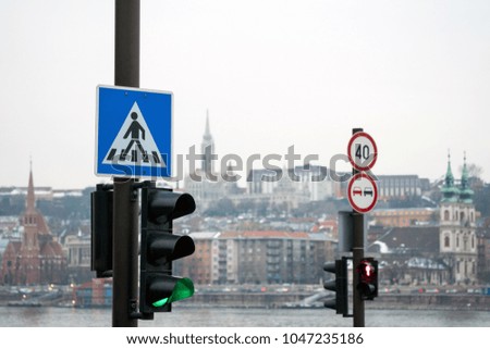 Semaphores with pedestrian crossing sign and speed limit sign in Budapest, Hungary