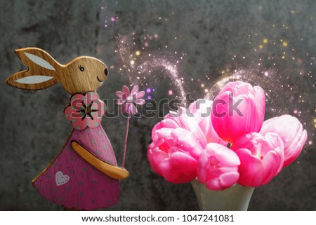 Easter Bunny and pink tulips as Easter decoration