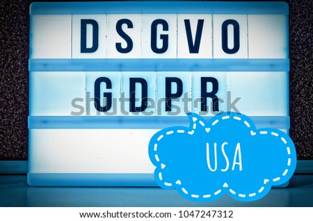 Illuminated plate with the inscription DSGVO and GDPR (german: Datenschutzgrundverordnung) blue in English GDPR (General Data Protection Regulation) and the inscription USA in English: United States