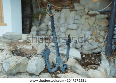 old anchor in the stones