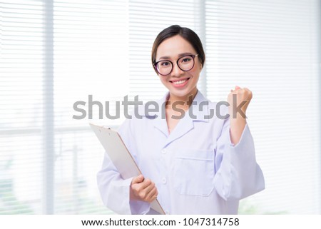 Portrait of asian woman doctor standing at hospital